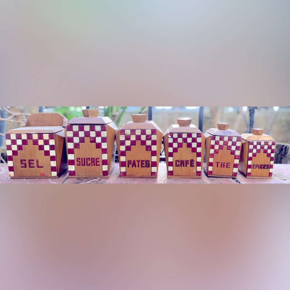 Vintage handmade wooden kitchen canisters from France in Lustucru style.
